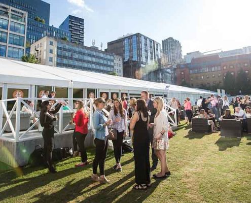 corporate guest enjoy drinks on the lawn at the hac artillery garden for a summer party